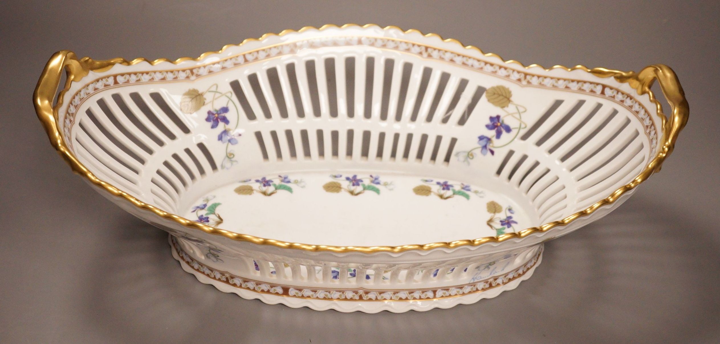 A Haviland Limoges fruit basket, painted with trailing flowers, 41cm